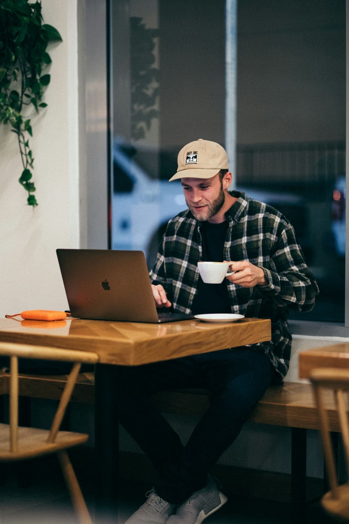 A business owner working on his laptop in a café